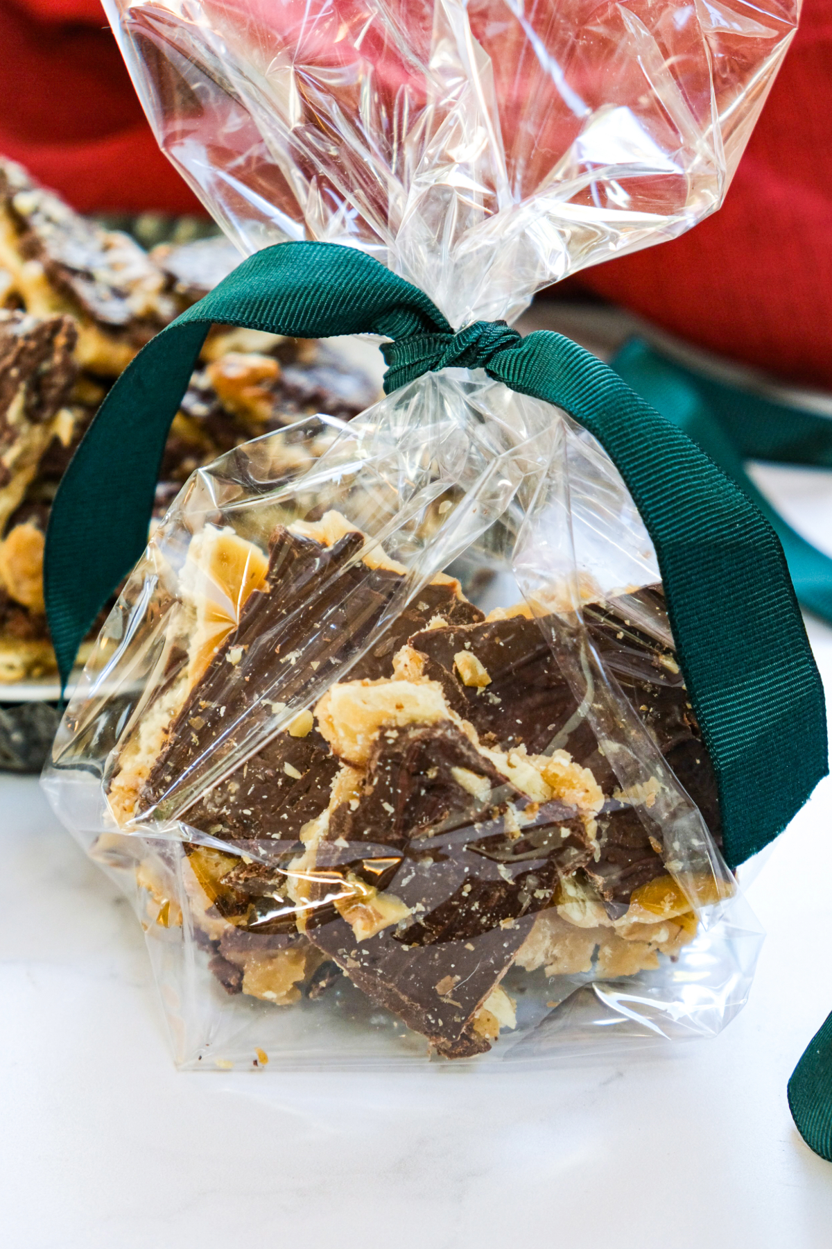 brickle cookies in a cellophane bag with a green ribbon.