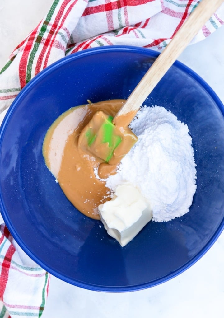 No bake snowballs ingredients in a blue mixing bowl. 