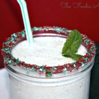blended mint smoothie made with Greek yogurt in a clear glass