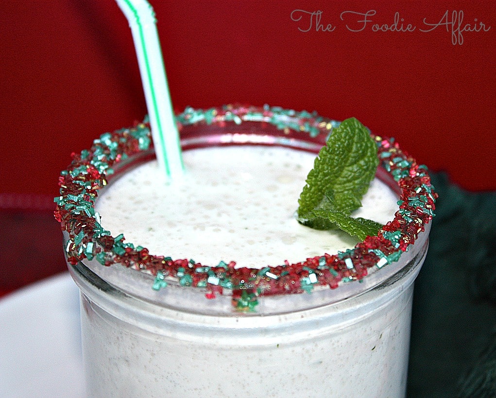 blended mint smoothie made with Greek yogurt in a clear glass