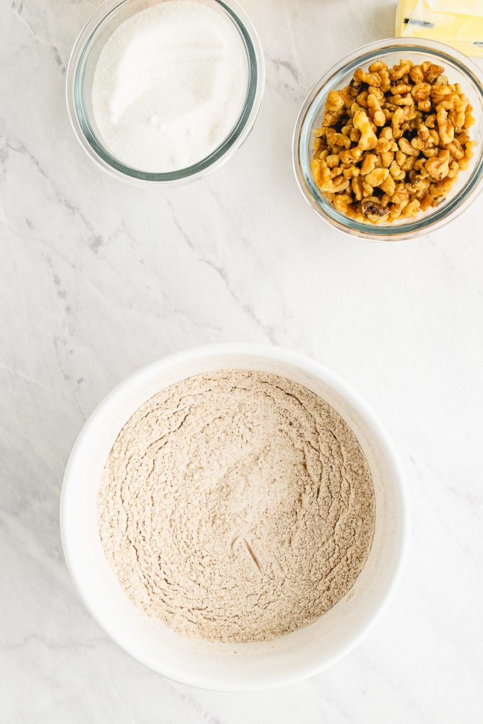 Dry ingredients in white mixing bowl for cookies.