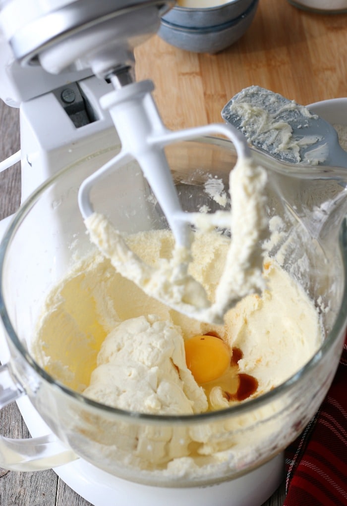 Now we can see into the mixer as eggs are being added to the ricotta cheese cookies batter.
