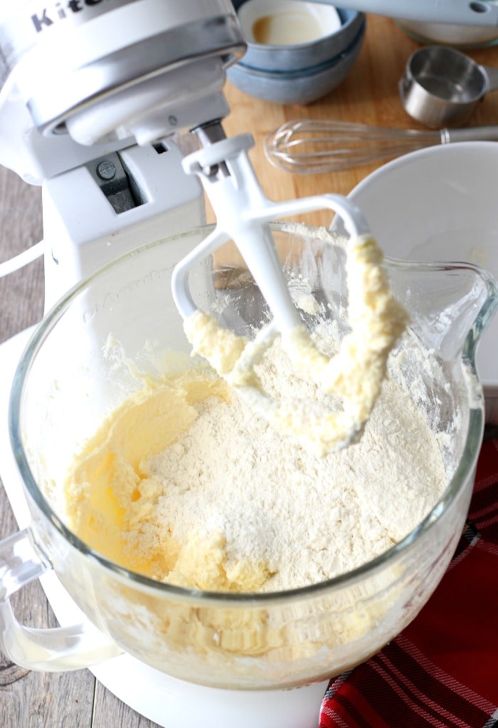 Now we have to add in the dry ingredients, the stand mixer does the hard work of mixing these ricotta cheese cookies for us!