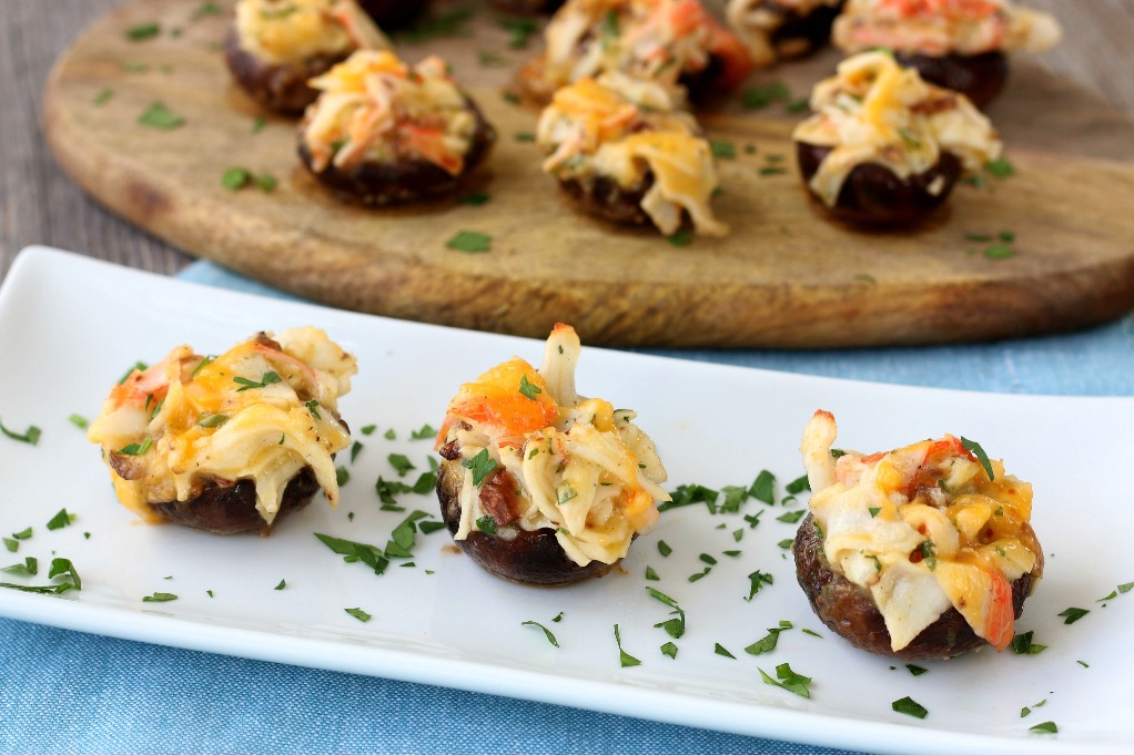 A horizontal view of the finished crab stuffed portabella mushrooms.