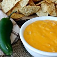 Homemade nacho cheese sauce in a white bowl