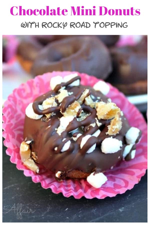 Chocolate Mini Donuts with rocky road topping! These double chocolate bite size donuts only take about 8 minutes to bake, but your patience will be tested when you add the cooling and waiting time it takes before getting another batch in the oven! #mini #donut #recipe #sweet #chocolate #dessert | www.thefoodieaffair.com