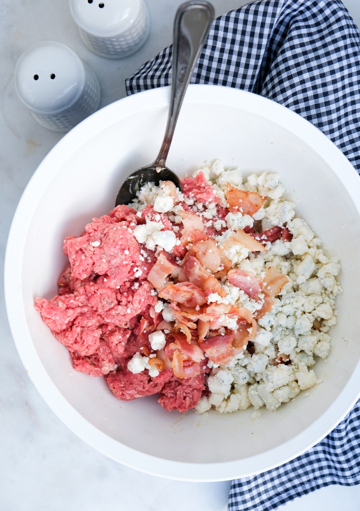 Mixed ground beef before folding in blue cheese and bacon pieces. 