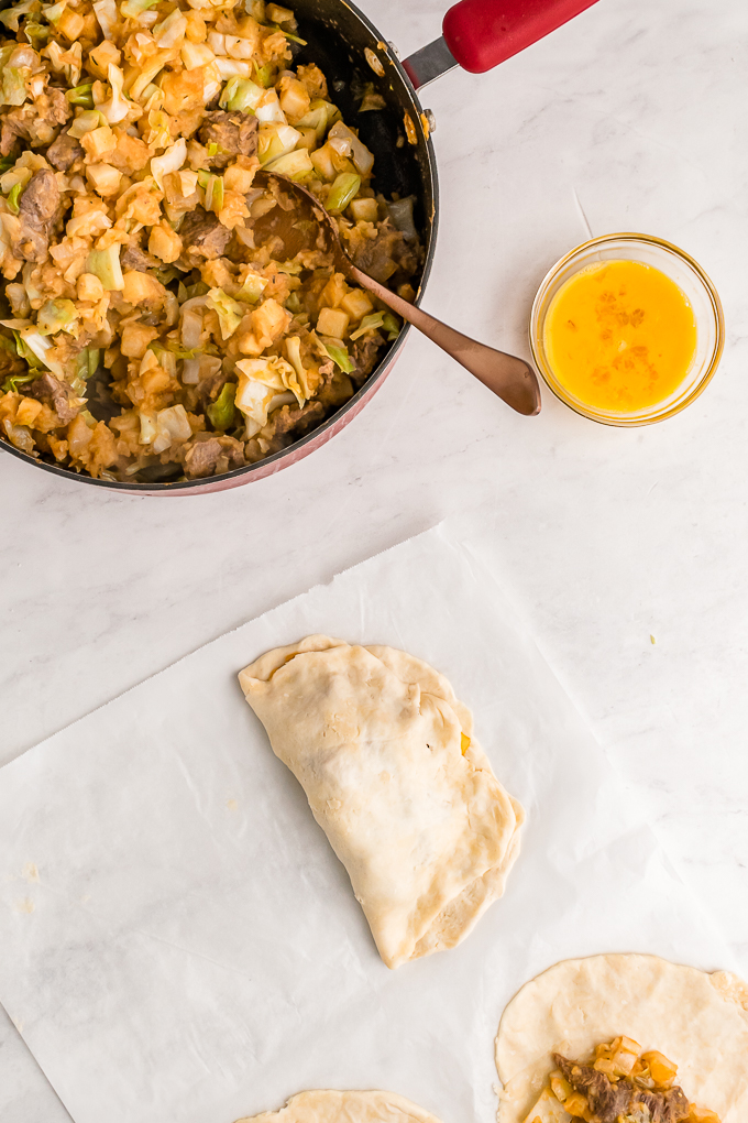 Meat filled hand pie ready to cook.