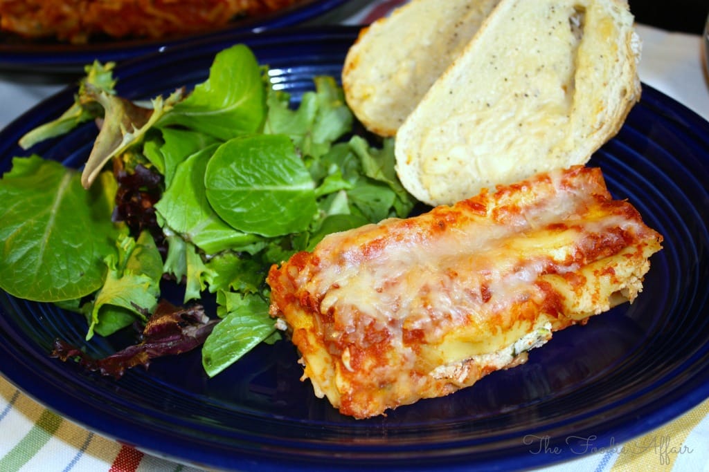 Plate of cheese and spinach manicotti. 