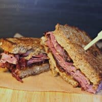 Grilled pastrami sandwich on a cutting board