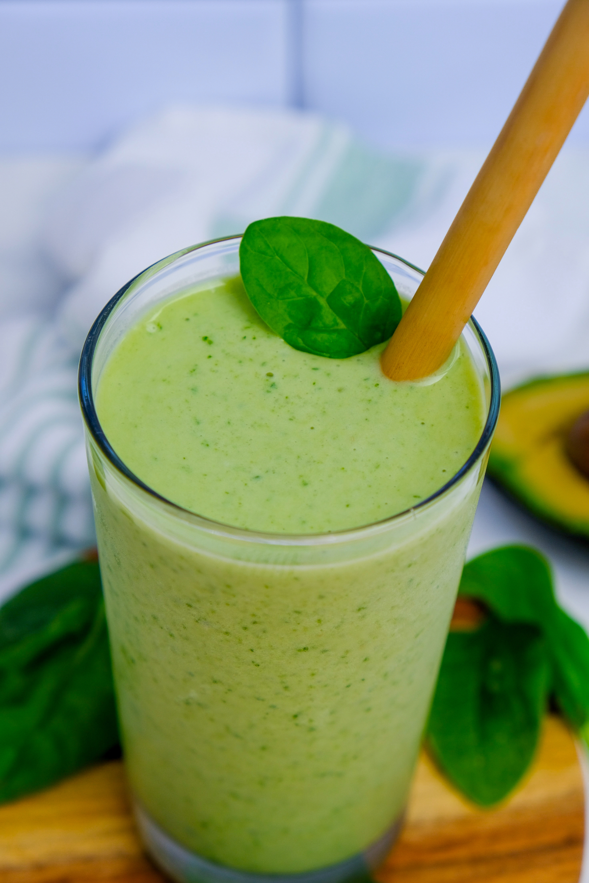 Top view of green spinach and avocado smoothie.