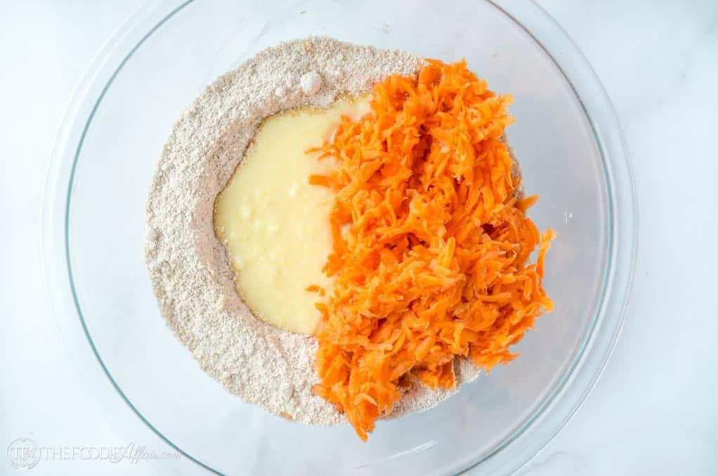 carrot cake cookie ingredients in a clear bowl