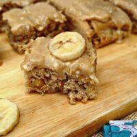 Browned Butter Banana Cake sliced on a cutting board