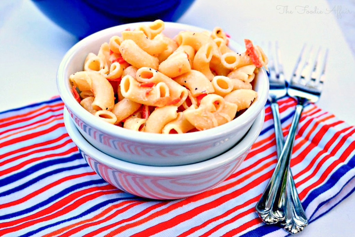 Hawaiian style macaroni salad in a white serving dish.