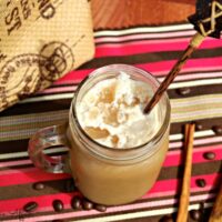 Homemade frosty cappuccino in a mason jar ready to be drank