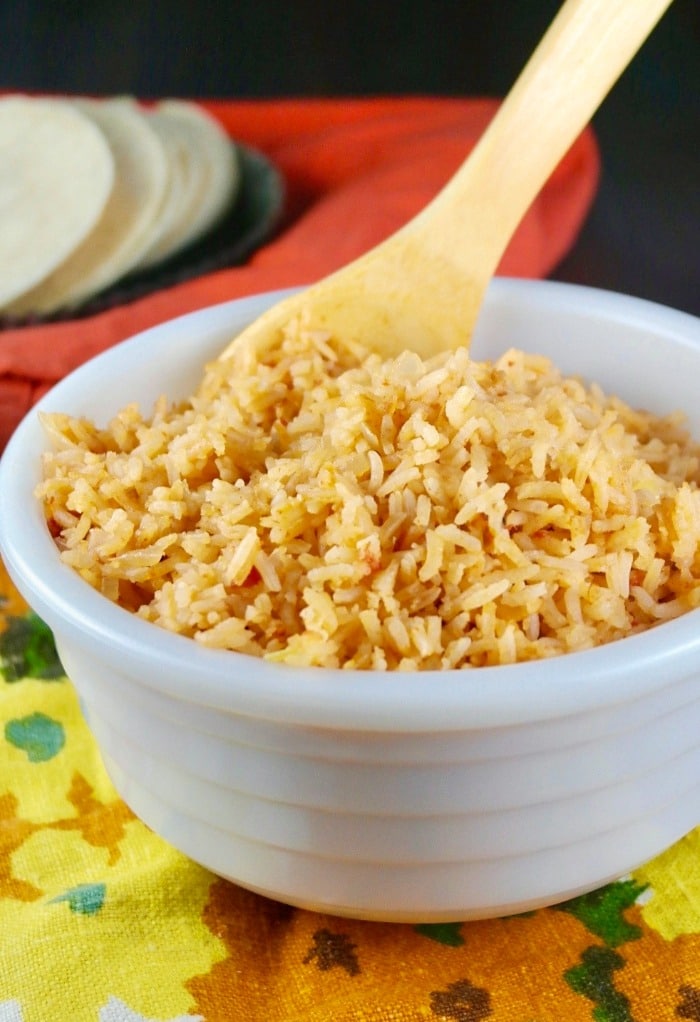 Spanish rice in a white serving bowl.