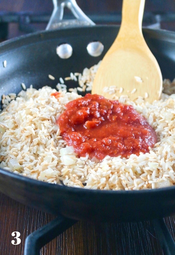 Tomato sauce added to Spanish rice recipe.