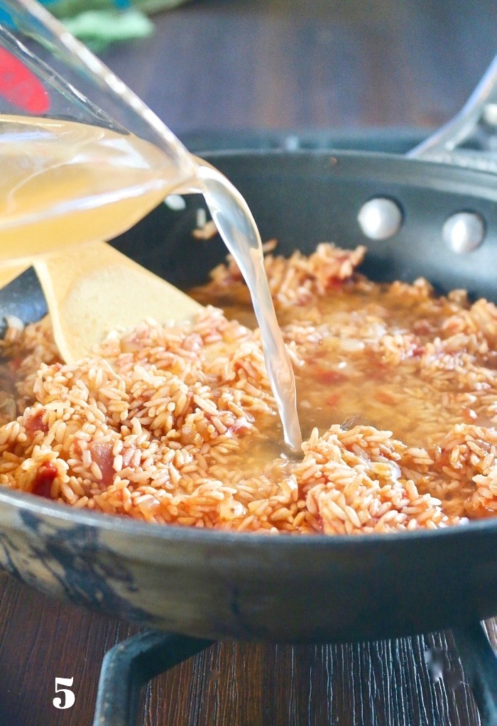 Adding vegetable broth to Mexican rice recipe. 