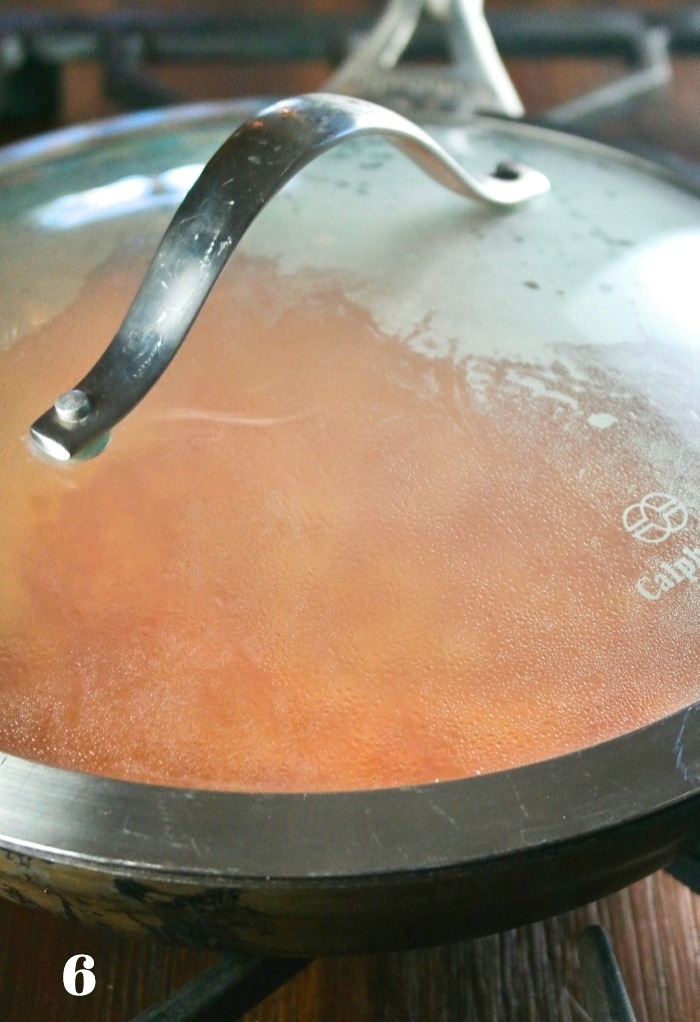 Cover skillet with clear lid to cook Spanish Rice