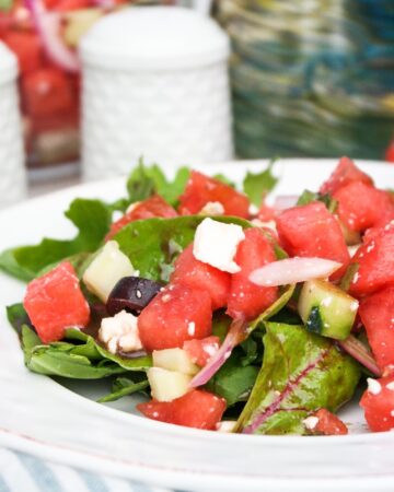 Mediterranean watermelon salad on a white plate.