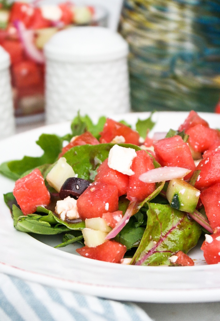 Mediterranean watermelon salad on a white plate.