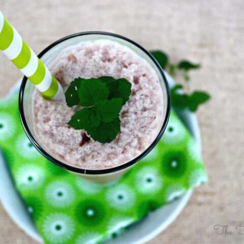 Chocolate Mint Protein Smoothie with a green straw