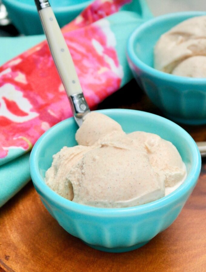A teal bowl filled with homemade ice cream