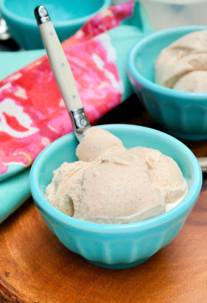 A teal bowl filled with homemade ice cream