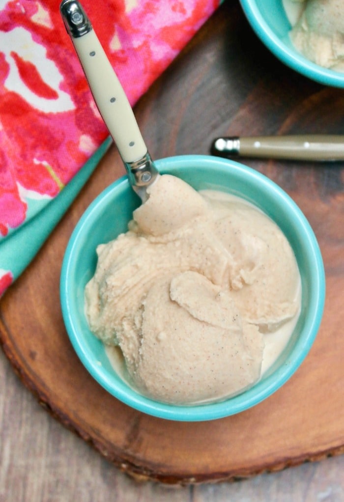 an overhead shot of a bowl of ice cream in a teal bowl