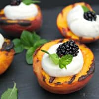 Grilled Peaches and Yogurt Cream with a fresh blackberry in the center