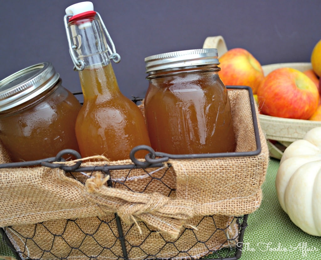 Apple Pie Moonshine  in a wire basket to be given as gifts. 