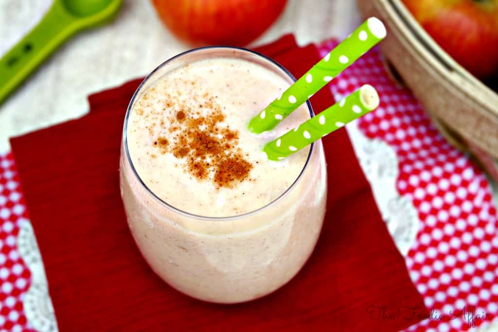 Apple Smoothie with Greek yogurt in a clear glass on a red napkin