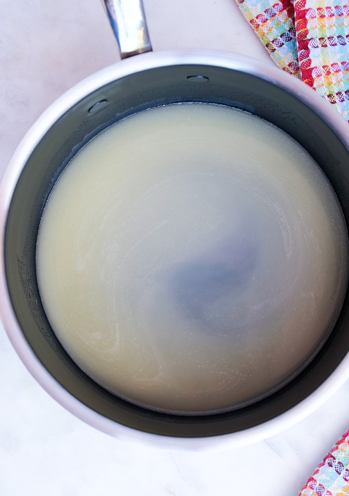 Saucepan with melted butter and water before cooking pastry dough.