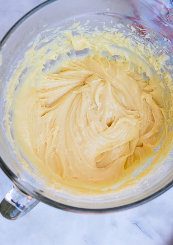 Pastry dough for churros in a glass mixing bowl.