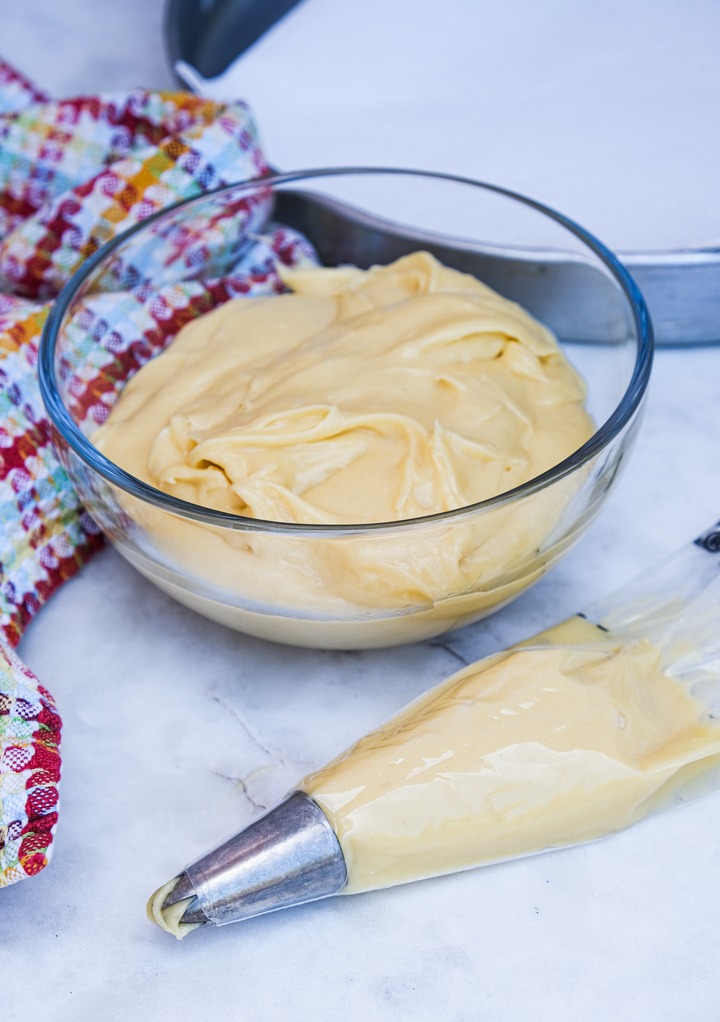 Churro dough in a pastry bag with a star tip for piping. 