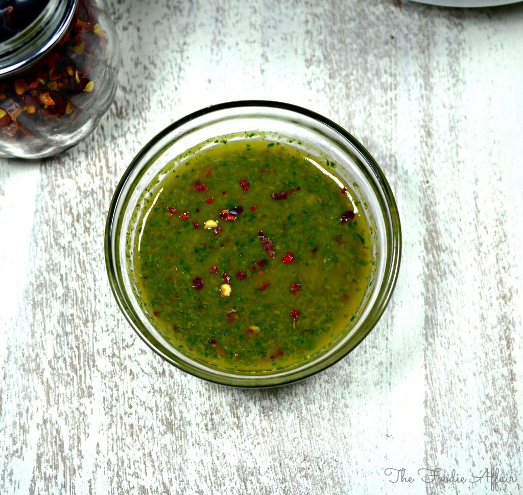 Chimmichurri sauce in a clear bowl