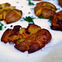 Crispy Smashed Potatoes topped with parsley