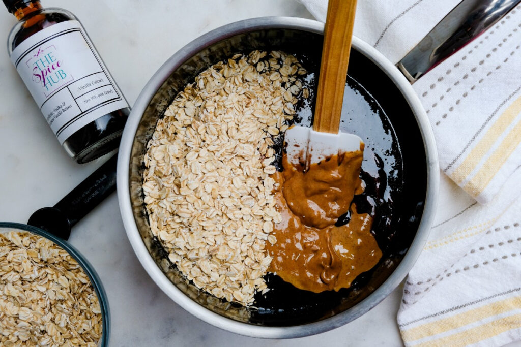 Oatmeal and peanut butter with old-fashioned oats in a saucepan. 