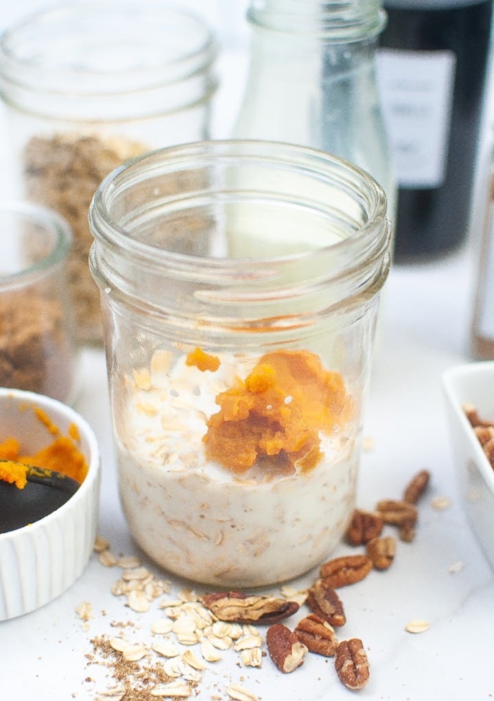 Ingredients to make oatmeal in a small mason jar. 