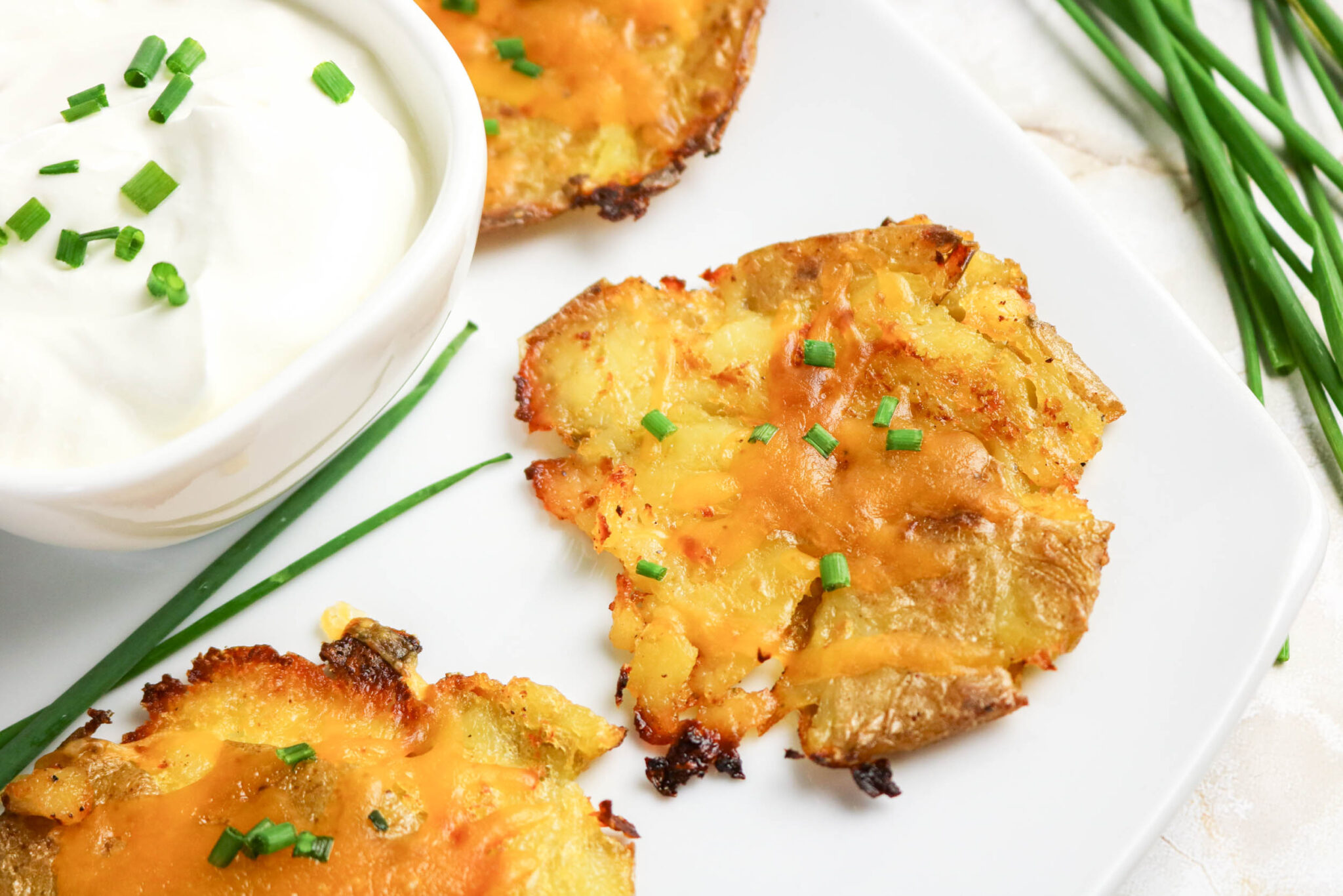 potato appetizer topped with melted cheese.