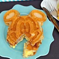 Breakfast Waffle Sandwich with Mickey Mouse on a teal plate