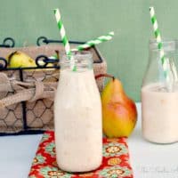 Pear Smoothie in clear milk jars with green straws