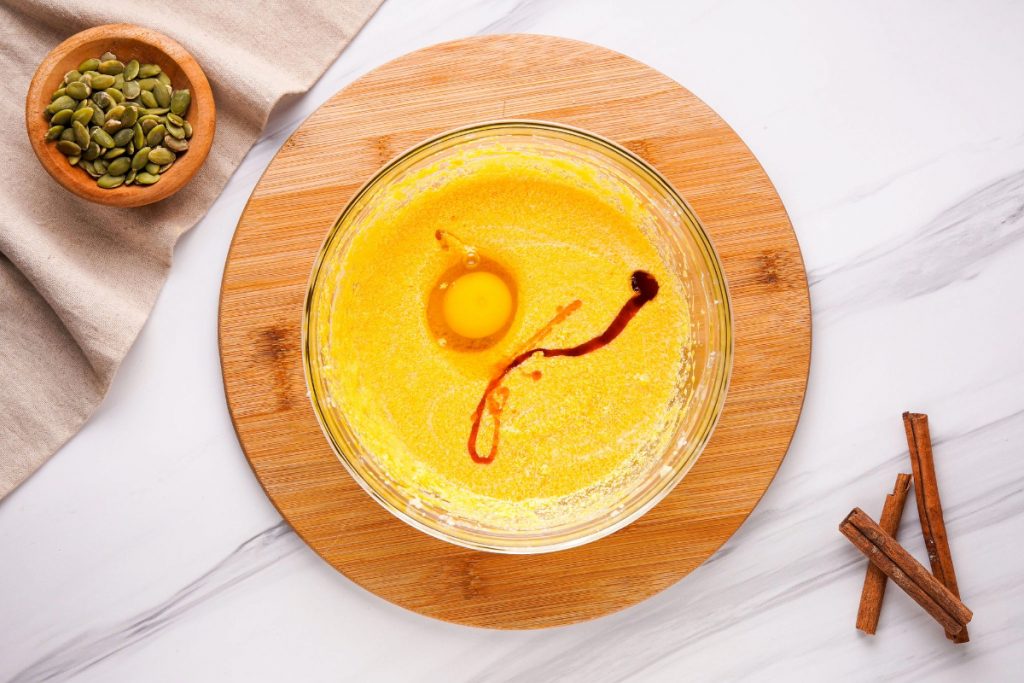 Wet ingredients in a clear mixing bowl. 