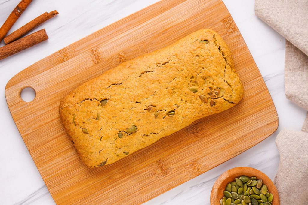 Homemade biscotti on a wooden board cooling. 