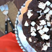 Rocky road cake on a silver cake platter.