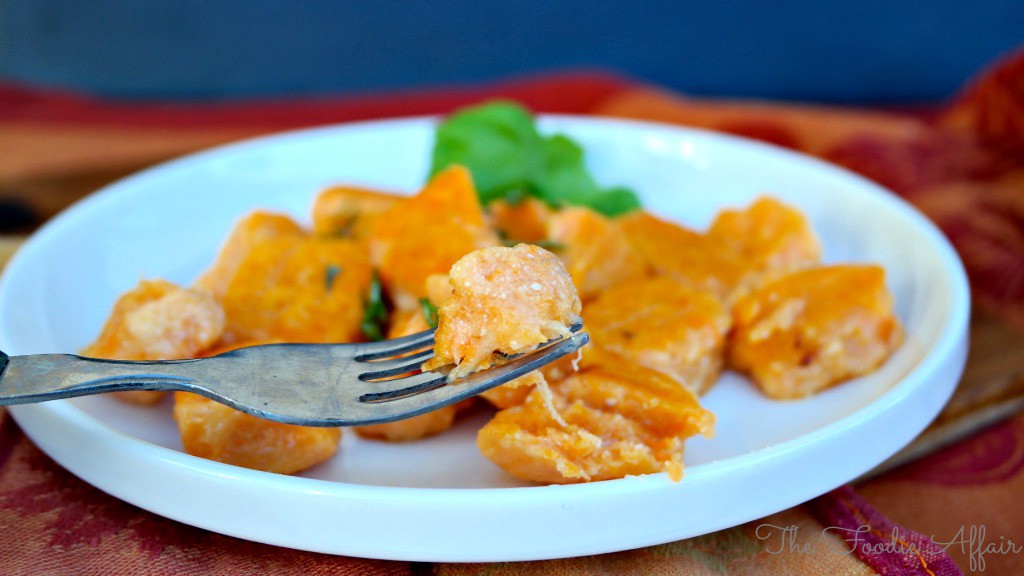 Sweet Potato Gnocchi on a white plate ready to be eaten.