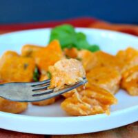 Sweet Potato Gnocchi on a white plate ready to be eaten.