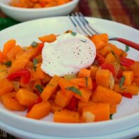 Butternut Squash Hash with Poached Eggs on a white plate