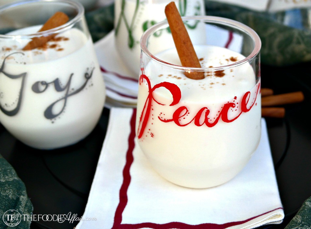 Coquito Cocktail in clear cups topped with cinnamon 