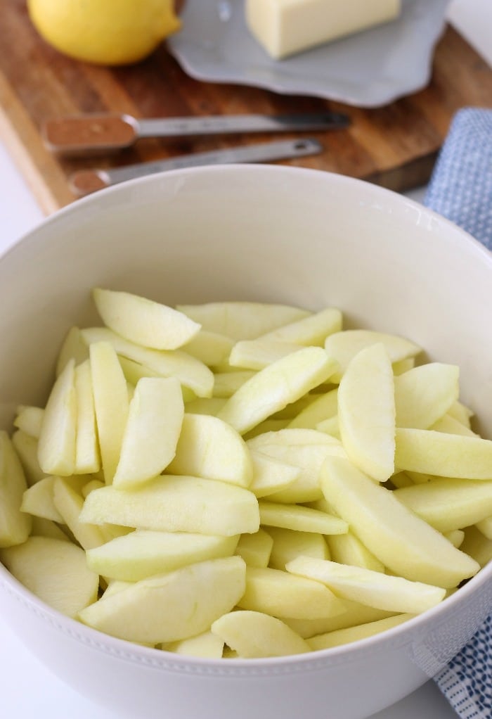 Image shows the peeled and sliced apples ready to be made into freezer apple pie filling.